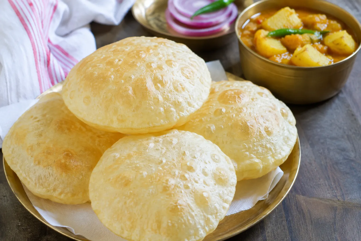Authentic Bengali Luchi served as soft, fluffy golden fried Indian bread